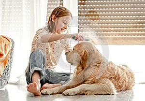 Girl with golden retriever dog