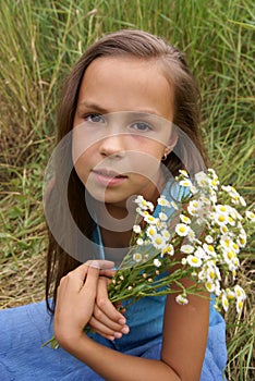 Preteen girl on grass background