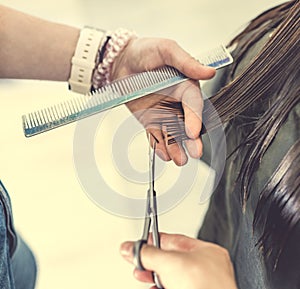 Preteen girl during haircut