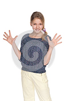 Preteen girl makes a hands gesture