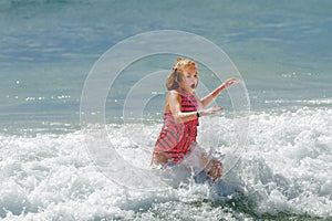 PreTeen Girl Running Out of the Cold Ocean Water Her Mouth is Op