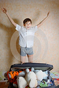 Preteen handsome boy jump with joy with anticipation of holiday