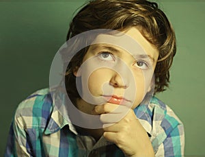 Preteen handsome boy think over difficult issue