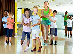 Preteen kids training in dance studio