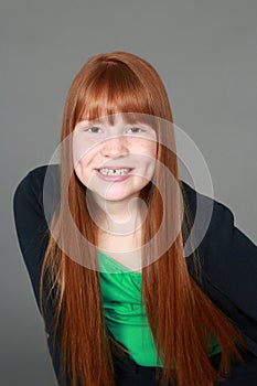 Preteen redhead girl with freckles and dimples