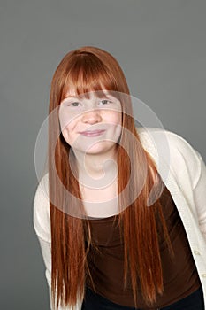 Preteen redhead girl with freckles and dimples