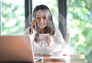 Preteen schoolgirl doing her homework with digital tablet at home