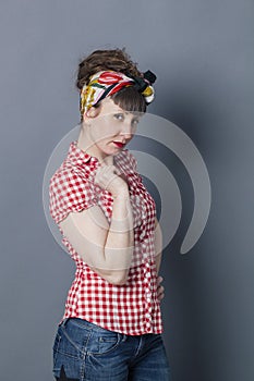 Pretentious trendy woman with gestures and hand on hip photo