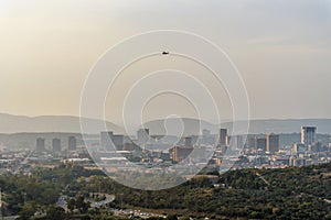 Pretoria skyline with helicopter above skyscrapers, capital city of South Africa