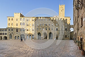 Pretorio Palace and Porcellino Tower, Priori square in a quiet moment of the afternoon, Volterra, Pisa, Tuscany, Italy