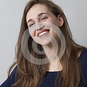 Pretty 20s girl enjoying success with happiness