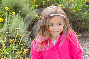 Pretty 4 year old Asian-Caucasian girl in pink coat