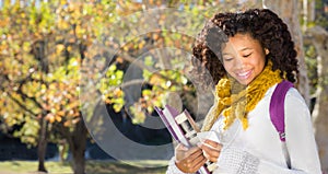 Back to School. Pretty Young Female Student with Mobile Phone