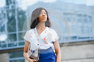 A pretty african american business woman at her office building