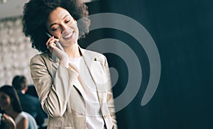 Pretty african american business woman talking on her mobile phone