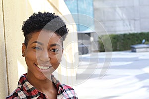 Pretty african american college student on campus with copy space on the right side of the photography