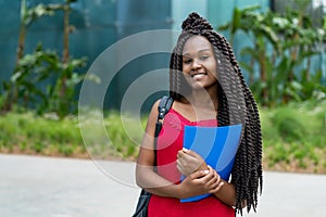 Pretty african american female student with amazing hairstyle