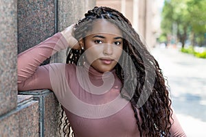 Pretty african american female young adult with braids