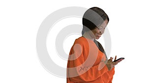 Pretty african american woman in bright jumper dictating message