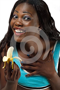 Pretty African American woman holding banana