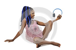 Pretty African American woman holding a headphone