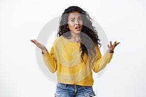 Pretty african-american woman pissed-off looking outraged, raise hands in dismay, complaining and arguing, talking photo