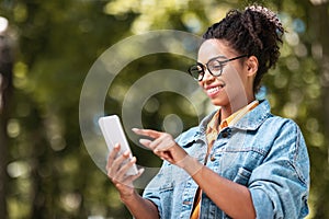 Pretty African Girl Using Mobile Phone Browsing Internet Walking Outside