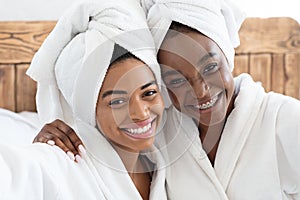 Pretty african women having ladies day at home