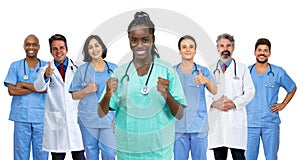 Pretty afro american female nurse with doctor and medical team