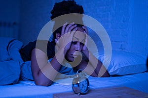 Pretty afro american woman can`t sleep in insomnia and mental health concept