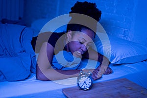 Pretty afro american woman can`t sleep in insomnia and mental health concept