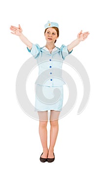 Pretty air hostess with arms raised