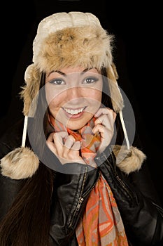 Pretty Asian American girl wearing winter clothes smiling