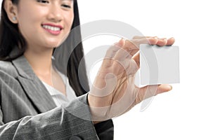 Pretty asian business woman showing blank business card on her hand standing