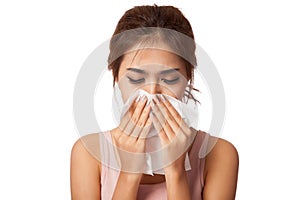 Pretty Asian girl Caught Cold. Sneezing into Tissue.