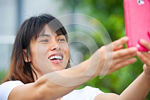 Pretty Asian girl taking a selfie