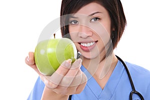 Pretty Asian Nurse with Apple
