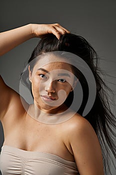 pretty asian woman with blemishes on