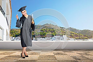 Pretty asian woman with graduation cap and diploma scroll