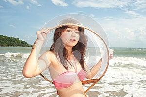 Pretty Asian woman joyfully with fishing scoop net .