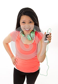 Pretty asian woman listening to music headphones