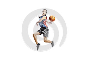 Pretty asian woman playing basketball