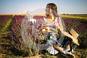 Pretty Asian Woman Posing With Bouquet In Lavender Field.