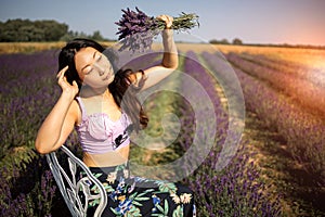 Pretty Asian Woman Posing With Bouquet In Lavender Field.