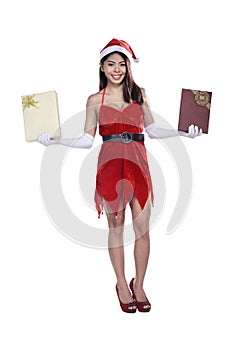 Pretty asian woman in santa costume holding gift box