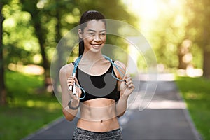 Pretty Athletic Asian Girl Exercising With Skipping Rope In Park, Training Outdoors