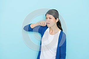 Pretty attractive standing in blue background