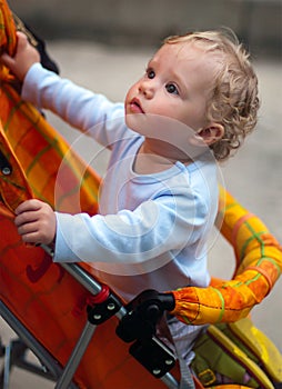 Pretty baby-girl in carriage