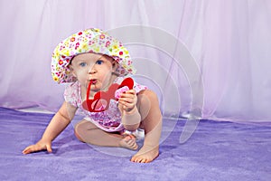 Pretty baby girl in a summer hat