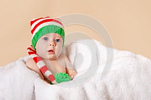 Pretty baby lying on soft fabric in the white box.. Merry Christmas